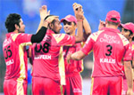 Praveen Kumar (2nd from left) celebrates with team mates after taking the wicket of Cape Cobra�s Herchelle Gibbs