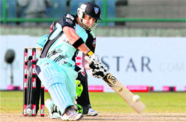 Phillip Hughes of New South Wales plays a shot against Sussex Sharks on Sunday.