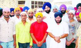 Patron of the Youth Akali Dal B.S.Majithia along with youths rescued from Iran on Monday.