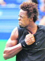 Gael Monfils reacts after wining a point against Lleyton Hewitt during the Shanghai Masters tennis tournament in Shanghai on Wednesday