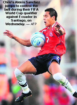 Chile�s Alexis Sanchez jumps to control the ball during their FIFA World Cup qualifier against Ecuador in Santiago, on Wednesday. � AFP