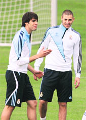 Real Madrid�s Kaka (L) and Karim Benzema during a training session in Madrid on Tuesday. 