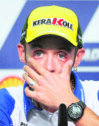 Yamaha MotoGP rider Valentino Rossi gestures during a news conference at Sepang circuit outside Kuala Lumpur on Thursday.