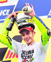 World Champion Italian rider Valentino Rossi celebrates his seventh Moto GP title win at the Malaysian Motocycle Grand Prix held at the Sepang racing circuit on Sunday. 