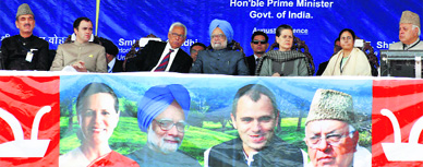Prime Minister Manmohan Singh flanked by UPA chairperson Sonia Gandhi, J&K CM Omar Abdullah, Minister for New and Renewable Energy Farooq Abdullah, Union Railways Minister Mamata Banerjee and Governor NN Vohra at a public meeting in Anantnag on Wednesday.