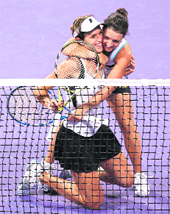 Maria Jose Martinez Sanchez (L) and Nuria Llagostera Vives celebrate after beating Serena Williams and Venus Williams at the WTA Tennis Championships, in Doha on Saturday.