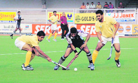 PNB and Namdhari-XI players in action on Sunday.
