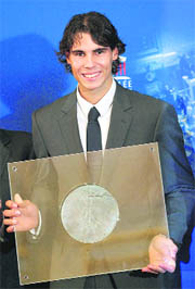 Rafael Nadal poses with his trophy after being awarded the Sports Academy Prize, in Paris on Tuesday.