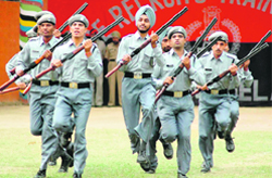 Recruits in action during a mock drill at their passing-out parade at the Police Recruitment Training Centre at Jahankhelan, near Hoshiarpur