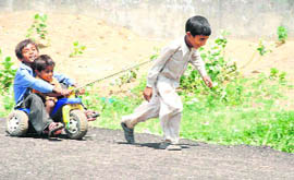 Children in a playful mood at Balsmand village near Hisar.