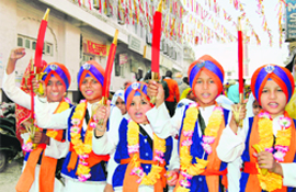 Children take part in the nagar kirtan procession held in Amritsar on Monday in connection with the martyrdom day of Guru Teg Bahadur