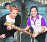 British Formula One driver Jenson Button (left) holds the Queen�s Baton for the 2010 Delhi Games on its way from Guernsey to Gibraltar