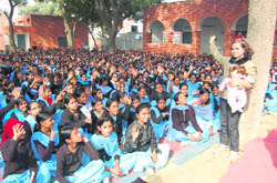Ishita Uppal, state�s brand ambassador against female foeticide, with schoolgirls in Fatehabad.