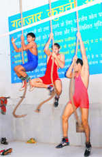 Wrestlers train during their early morning training session at the Guljar Akhara