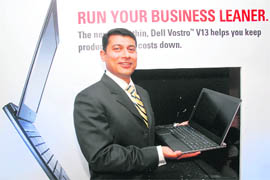 Ravi Bharadwaj, general manager, Dell India, poses with ultra-portable �Dell Vestro V13� laptop at its launch in New Delhi on Tuesday. 'Vostro V13' is aimed at small and medium businesses and is priced at Rs 28,500. It is 16.5 mm thick, weighs 1.59 kg and is equipped with ultra-low-voltage Intel (ULV) processors to manage energy efficiency. 