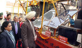 Deputy Commissioner Ajeet Singh Pannu and Additional DC (Development) Sarojani Gautam Sharda check solar machines in Jalandhar. 