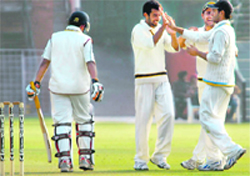 Love Ablish (2nd L) celebrates a wicket