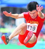 China�s Li Jinzhe competes during the men�s long jump final at the East Asian Games in Hong Kong