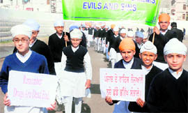 Students of the Akal Academy hold an anti-drug procession in Bathinda on Friday.