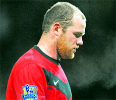 Manchester United�s Wayne Rooney leaves the pitch after their defeat at Old Trafford, Manchester, on Saturday.