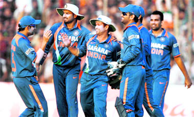 Indian cricketers celebrate the wicket of Angelo Mathews during the first ODI against Sri Lanka in Rajkot on Tuesday.
