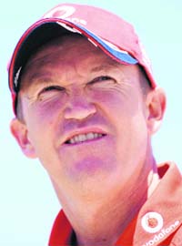 England�s cricket coach Andy Flower gestures during a press conference