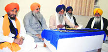 The five Sikh high priests hold a meeting at the Akal Takht secretariat in the Golden Temple complex in Amritsar on Monday. 