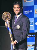 Indian cricket captain M S Dhoni with the Reliance Mobile ICC Test Championship mace in New Delhi on Sunday. 