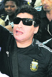 Argentine coach Diego Maradona arrives at Johannesburg airport on Monday.