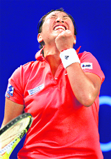 Thailand's Tamarine Tanasugarn celebrates her victory over Russia's Anna Chakvetadze at the WTA Tour PTT Pattaya Women's Open on Friday.