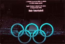 The Olympic Rings and sign honoring fallen Georgian Luger Nodar Kumaritashvili, in the stadium during in Vancouver on Saturday