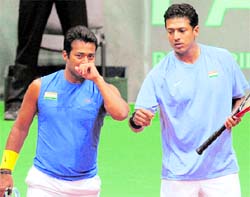 Mahesh Bhupathi (R) and Leander Paes celebrate a point on Saturday
