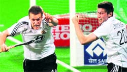 Germany�s Oliver Korn (L) celebrates a goal against Netherland in New Delhi on Sunday