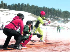 Players in action during the final of the first snow baseball championship at Gulmarg on Monday