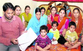 Members of Hindu families from Pakistan living in Jalandhar show documents on the basis of which they have sought Indian citizenship. Tribune photo: Malkiat Singh
