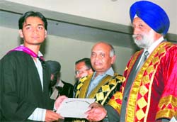 A student of Government Rajindra College, Bathinda, receives his degree from Punjab Vidhan Sabha Speaker Nirmal Singh Kahlon at the convocation held on the premises of the institution on Saturday. Tribune photo: Pawan Sharma