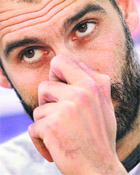 Barcelona�s coach Pep Guardiola listens to a question about their next Champions League match against Arsenal during a news conference in Barcelona on Saturday.