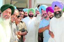Congress leaders with Capt Amarinder Singh in Mohali on Sunday. 