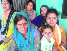 The mother and the sister of Sachin in Mahal village, near Phagwara, on Saturday.