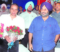 Actor Dharmendra (L) with deputy CM Sukhbir Badal in Patiala on Saturday.