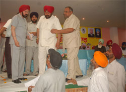 People pleading before the chairman of the Punjab State Human Rights Commission RS Mongia, during a seminar on human rights, organised in Bathinda on Sunday. 