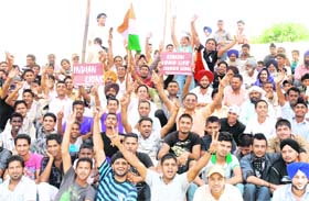 Kabaddi enthusiasts from villages showing placards, banners and flags in support of the World Kabaddi Cup in Jalandhar