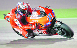 Ducati MotoGP rider Casey Stoner rides during a free practice session at the MotoGP World Championship at the Losail international circuit in Doha on Friday.