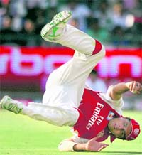 Kings XI�s Reetinder Sodhi takes a catch to get rid of Rajat Bhatia on Sunday. � PTI