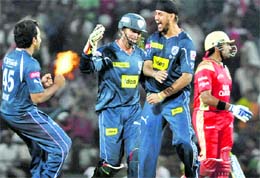 Deccan Chargers� Harmeet Singh celebrates with teammates the wicket of Robin Uthappa in Nagpur on Monday. � PTI 