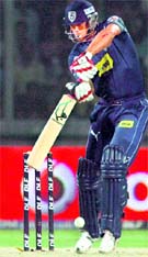 Andrew Symonds plays a shot at Firozshah Kotla in New Delhi on Sunday. � PTI