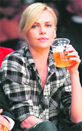 Actress Charlize Theron sits courtside during Game 2 of the NBA Western Conference playoff series between the Los Angeles Lakers and Oklahoma City Thunder in Los Angeles, on Tuesday.