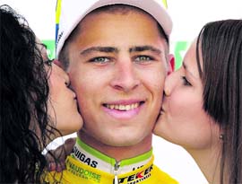 Liquigas' team rider Peter Sagan of Slovakia smiles on the podium after wearing the leader's jersey after the second stage of the Tour de Romandie cycling race in Fribourg on Thursday.