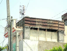The under-construction phone tower in a residential area of Patiala.