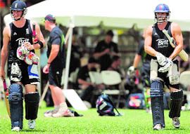 England cricketers Craig Kieswetter(L) and Michael Lumb come out to bat in the nets at the Everest Cricket Club in Guyana on Saturday. � AFP